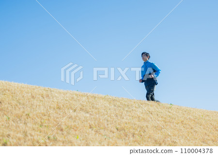 A man running on the riverbed A man running on the riverbed 110004378