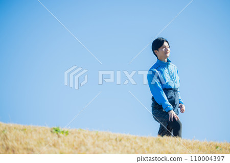 A man running on the riverbed A man running on the riverbed 110004397