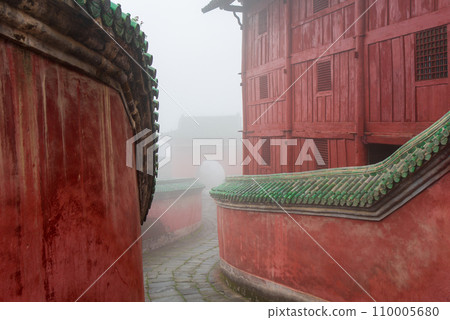 The mysterious ancient building complex of Wudang Mountain in the fog. 110005680