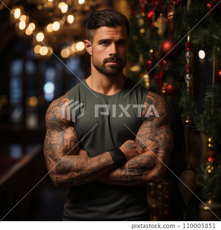 A bodybuilder's flexed arm with a Christmas tattoo, against a backdrop of green festive decorations, showcasing a blend of fitness and holiday spirit 110005851