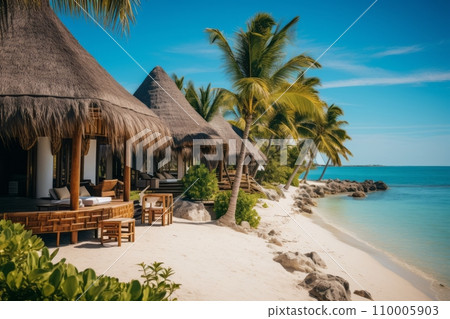 A luxurious beach resort on a tropical island, thatched bungalows nestled among lush palm trees, overlooking the white sandy beach and azure waters A luxurious beach resort on a tropical island, thatched bungalows nestled among lush palm trees, overlooking the white sandy beach and azure waters 110005903