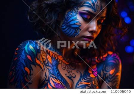 A stunningly radiant girl with ultraviolet body art, her skin illuminates under the vibrant, neon glow of ultraviolet light. A stunningly radiant girl with ultraviolet body art, her skin illuminates under the vibrant, neon glow of ultraviolet light. 110006040