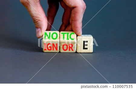 Notice or ignore symbol. Concept word Notice or Ignore on wooden cubes. Beautiful grey table grey background. Businessman hand. Business lifestyle and notice or ignore concept. Copy space. Notice or ignore symbol. Concept word Notice or Ignore on wooden cubes. Beautiful grey table grey background. Businessman hand. Business lifestyle and notice or ignore concept. Copy space. 110007535