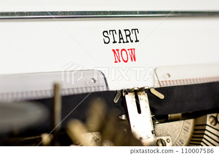 Start now symbol. Concept words Start now typed on beautiful old retro typewriter. Beautiful white paper background. Business marketing, motivational start now concept. Copy space. 110007586