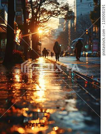 People walking on the street at dusk after the rain 110008191