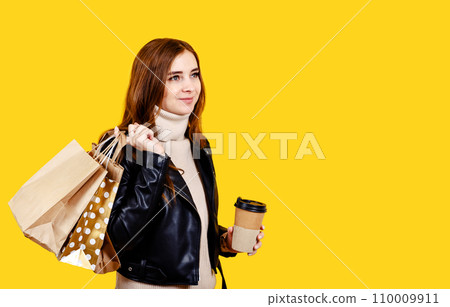 Smiling woman hold shopping package bags. Shopping in online stores 110009911