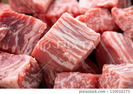 A close-up of beef (fillet) cut for diced steak. 110010273
