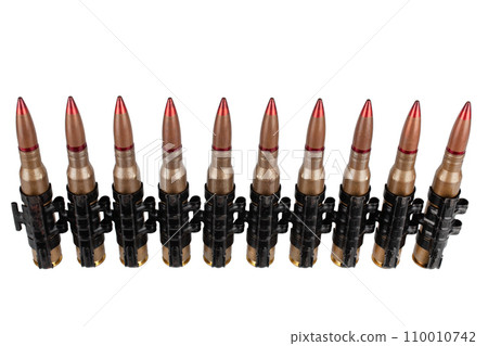 Ammunition belt with cartridges for heavy machine gun isolated on white. 110010742
