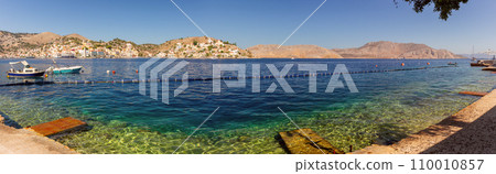 Multi-colored facades of houses in the village Symi on a sunny day. Multi-colored facades of houses in the village Symi on a sunny day. 110010857