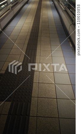 A pedestrian bridge at night. A pedestrian bridge at night. 110010858