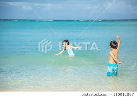 Children playing in the sea Children playing in the sea 110012897