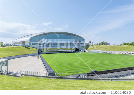 Sapporo City, Hokkaido - Sapporo Dome on a sunny day where various events are held and a hovering soccer stage under maintenance 110014020