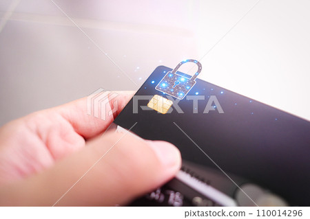 Hand holding credit or debit card with padlock , protection of financial transactions Hand holding credit or debit card with padlock , protection of financial transactions 110014296