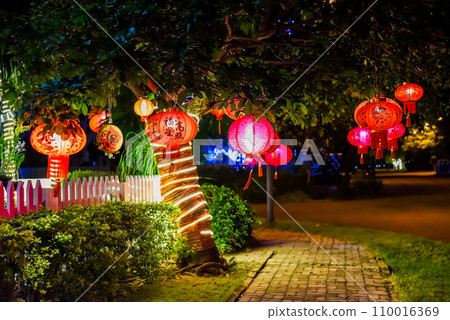 Many red lanterns with vietnamese language translated as "Happy New Year" hanging in Vietnam for Tet Lunar New Year Many red lanterns with vietnamese language translated as "Happy New Year" hanging in Vietnam for Tet Lunar New Year 110016369