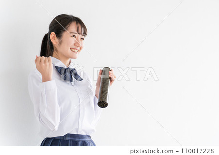 Smiling high school student, junior high school student, high school girl with a diploma in a school classroom (graduation ceremony, uniform, school uniform) 110017228