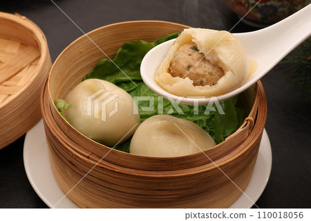 Xiaolongbao served in a steamer basket 110018056