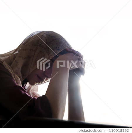 Praying woman at the window Praying woman at the window 110018392