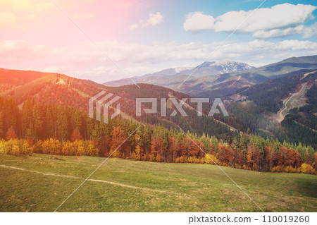 Autumn in the mountains. View of the mountains in autumn. Beautiful nature landscape. Carpathian mountains. Bukovel, Ukraine 110019260
