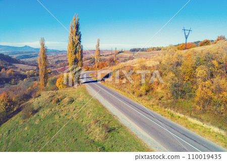 Panoramic aerial view of the mountains. Mountain highway. Beautiful mountain spring landscape. Carpathian mountains. Ukraine Panoramic aerial view of the mountains. Mountain highway. Beautiful mountain spring landscape. Carpathian mountains. Ukraine 110019435