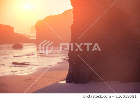 Seascape in the morning. Rocky sea coast at sunrise. Beach Playa de Las Catedrales in Ribadeo, Galicia, Spain, Europe 110019581