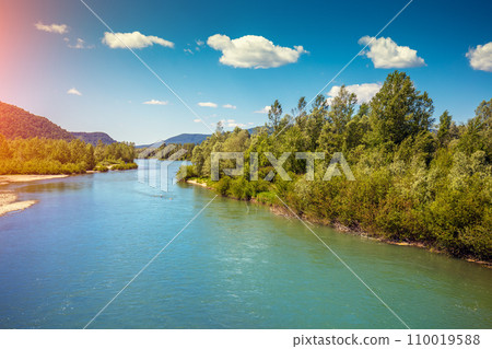 View of mountain valley and river. Springtime. Tisza (Tysa, Tisa) river. Khust, Zakarpattia Oblast Ukraine, Europe View of mountain valley and river. Springtime. Tisza (Tysa, Tisa) river. Khust, Zakarpattia Oblast Ukraine, Europe 110019588