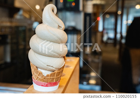 Coffee soft serve ice cream, coffee-flavored ice cream from a cafe. Coffee soft serve ice cream, coffee-flavored ice cream from a cafe. 110020155