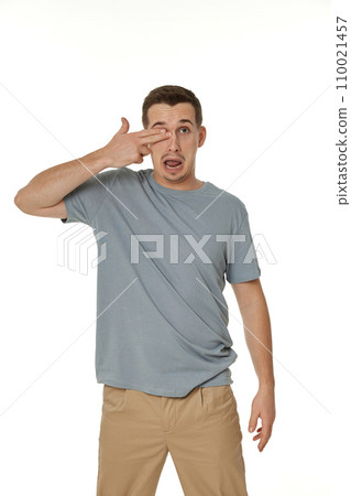 man covering eyes with hands on white background man covering eyes with hands on white background 110021457