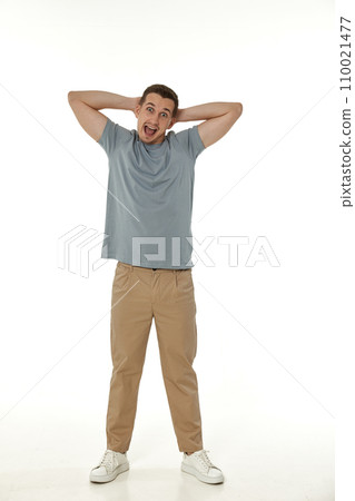 surprised guy looking at camera on white studio background surprised guy looking at camera on white studio background 110021477
