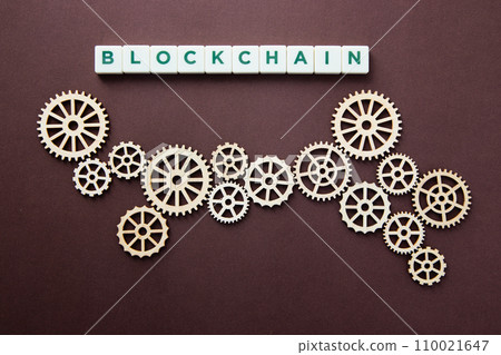Wooden gears with word Blockchain. Cryptocurrency concept 110021647