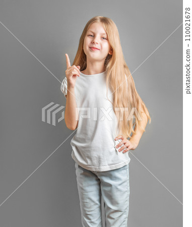 Adorable little girl direct finger up Adorable little girl direct finger up 110021678