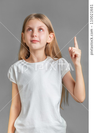 Adorable little girl direct finger up 110021681