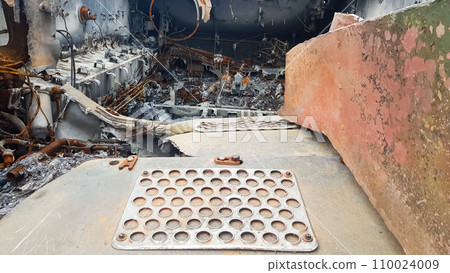 Destroyed Russian military equipment, destroyed armored car. War in Ukraine. Fragment of a rusty burnt car. Salon armored car armored personnel carrier. Remains of military equipment 110024009