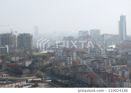 The view from the skyscraper window to the Asian part of Istanbul. City development in a haze. On the horizon of mountains and hills. The view from the skyscraper window to the Asian part of Istanbul. City development in a haze. On the horizon of mountains and hills. 110024186