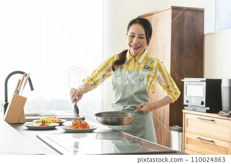 A woman serving food 110024863