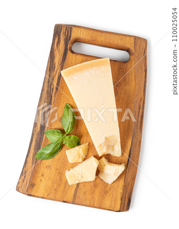 Parmesan cheese on a cutting board 110025054