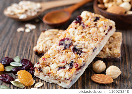 Granola bar on wooden background 110025248