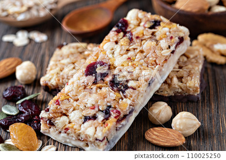 Granola bar on wooden background 110025250