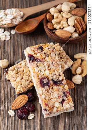 Granola bar on wooden background 110025254