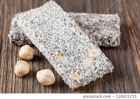 Granola bar on wooden background 110025255