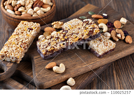 Granola bar on wooden background 110025257