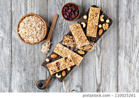 Granola bar on wooden background 110025261