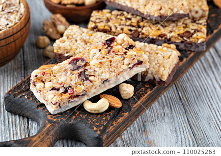 Granola bar on wooden background 110025263