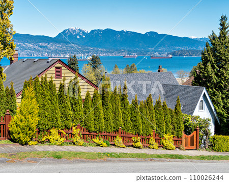 Ocean-going cargo vessels in Coal harbor bay in Vancouver 110026244