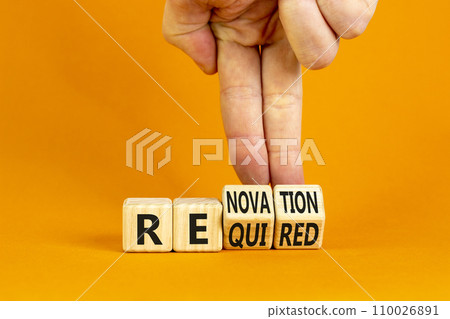 Required and renovation symbol. Concept words Required Renovation on wooden block. Beautiful orange table orange background. Businessman hand. Business required renovation concept. Copy space. 110026891