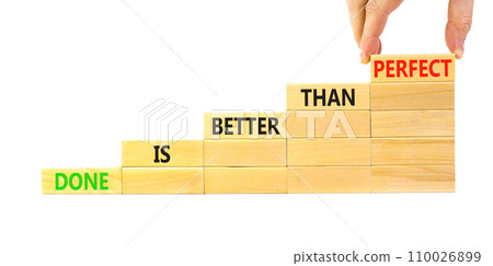 Done is better than perfect symbol. Concept words Done is better than perfect on wooden blocks. Beautiful white background. Businessman hand. Business, done is better than perfect concept. Copy space. Done is better than perfect symbol. Concept words Done is better than perfect on wooden blocks. Beautiful white background. Businessman hand. Business, done is better than perfect concept. Copy space. 110026899