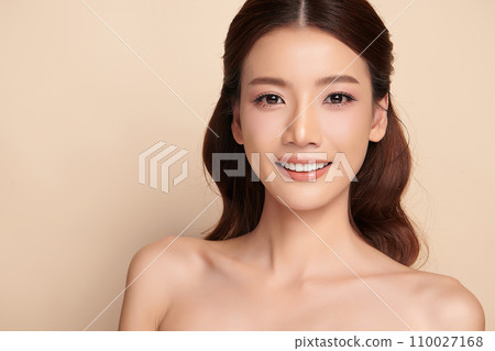 Beautiful young asian woman with clean fresh skin on beige background, Face care, Facial treatment, Cosmetology, beauty and spa, Asian women portrait. 110027168