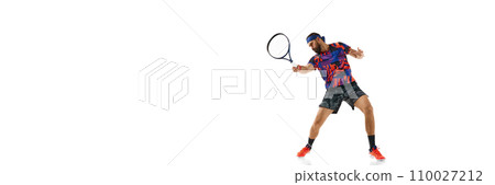 Bearded young man in colorful sportswear playing tennis, practicing isolated over white background. Sport, competition 110027212