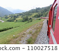 View from the window of the Albula Line of the Rhaetian Railway in Switzerland. A train running through nature. 110027518
