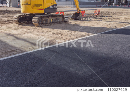 Heavy machinery and paving construction site Heavy machinery and paving construction site 110027629