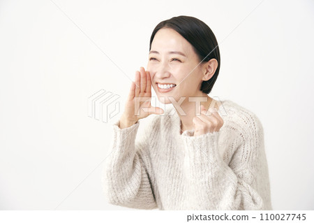 Middle-aged woman cheering white background 110027745